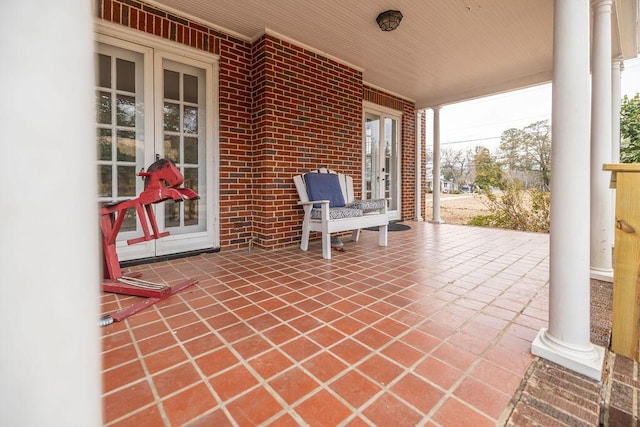 view of patio / terrace with french doors and a porch