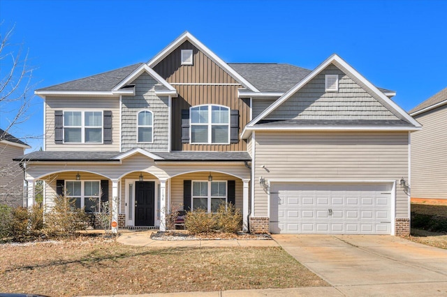 view of front facade with a garage and covered porch