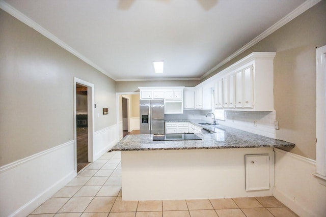 4552 Bettys Branch Way, Evans, GA 30809 - kitchen featuring black electric cooktop, a sink, white cabinets, a peninsula, and stainless steel fridge