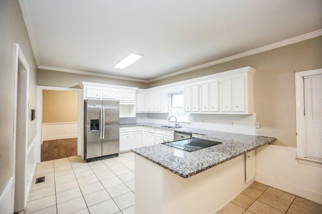 4552 Bettys Branch Way, Evans, GA 30809 - kitchen with white cabinets, stainless steel appliances, a sink, and a peninsula
