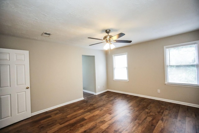4552 Bettys Branch Way, Evans, GA 30809 - spare room with a ceiling fan, baseboards, visible vents, and dark wood-style floors