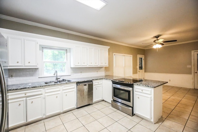 4552 Bettys Branch Way, Evans, GA 30809 - kitchen with white cabinets, stainless steel appliances, a sink, and a peninsula