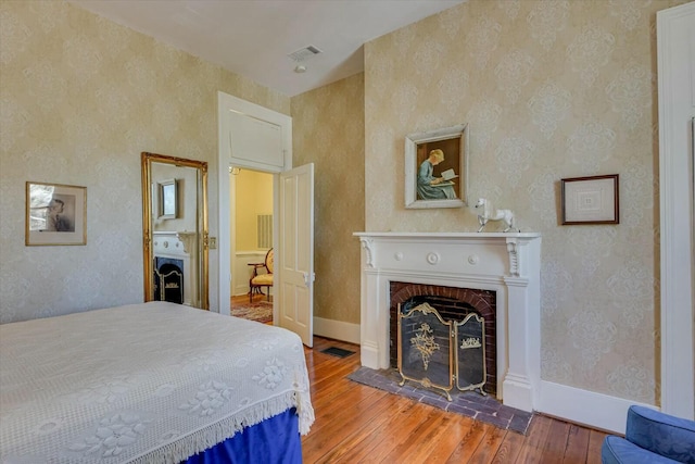 bedroom with hardwood / wood-style floors