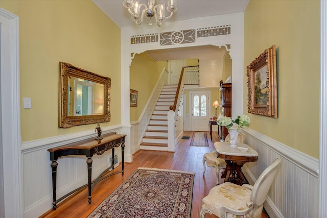 entryway with a notable chandelier and light hardwood / wood-style flooring