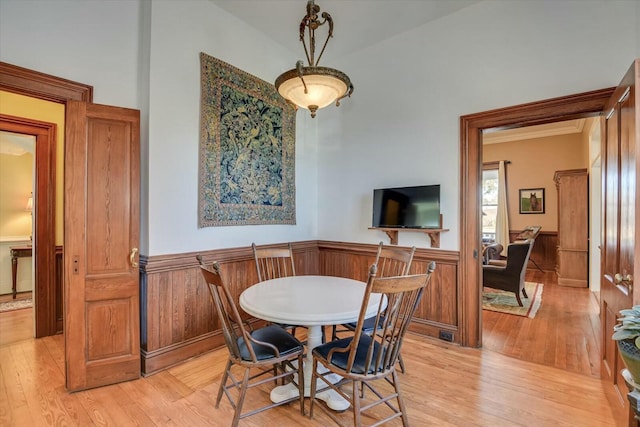 dining space with light hardwood / wood-style floors