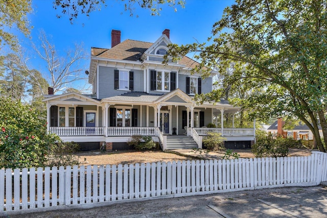 victorian-style house featuring a porch