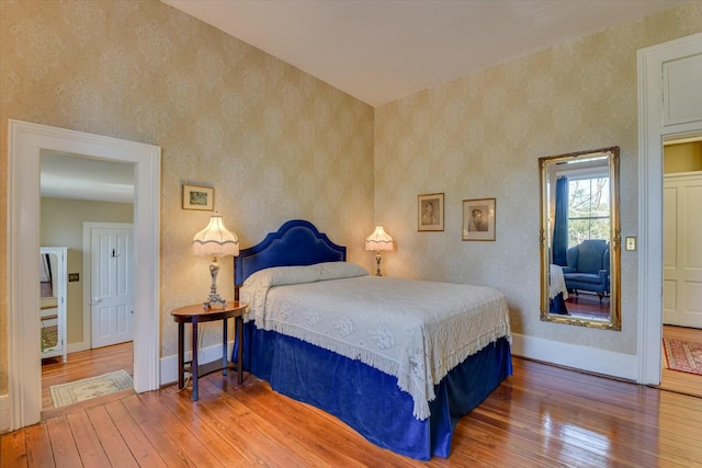 bedroom with hardwood / wood-style floors