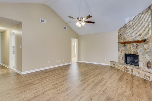 3831 Highpointe Dr, Hephzibah, GA 30815 - unfurnished living room with high vaulted ceiling, a ceiling fan, a fireplace, and wood finished floors