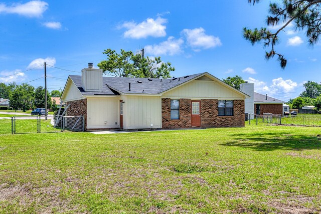3831 Highpointe Dr, Hephzibah, GA 30815 - rear view of house featuring a chimney, a fenced backyard, brick siding, and a gate