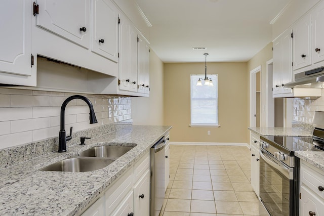 3831 Highpointe Dr, Hephzibah, GA 30815 - kitchen with stainless steel appliances, under cabinet range hood, backsplash, a chandelier, and white cabinets