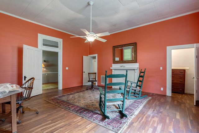 corridor featuring wood-type flooring, crown molding, and a notable chandelier