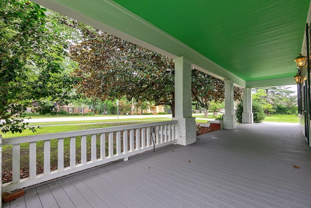 view of exterior entry with covered porch