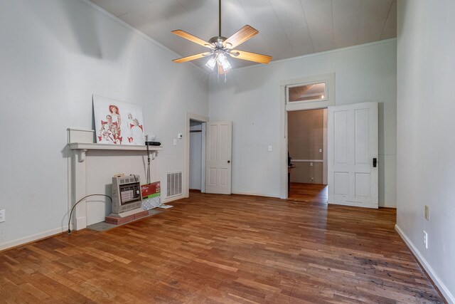 hallway featuring hardwood / wood-style floors, a chandelier, and ornamental molding