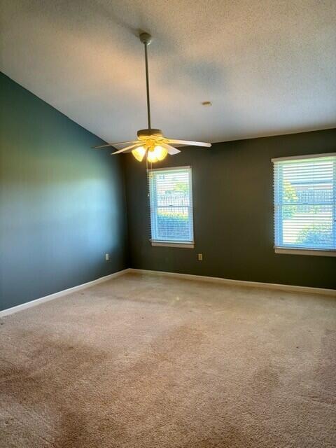 2949 Hillcreek Dr, Augusta, GA 30909 - unfurnished room featuring ceiling fan, healthy amount of natural light, carpet flooring, and baseboards