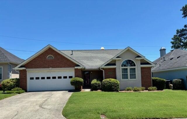 2949 Hillcreek Dr, Augusta, GA 30909 - ranch-style house featuring concrete driveway, a front yard, brick siding, and a garage