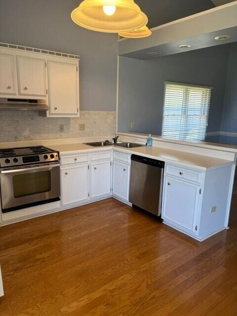 2949 Hillcreek Dr, Augusta, GA 30909 - kitchen with stainless steel appliances, a peninsula, a sink, and white cabinets