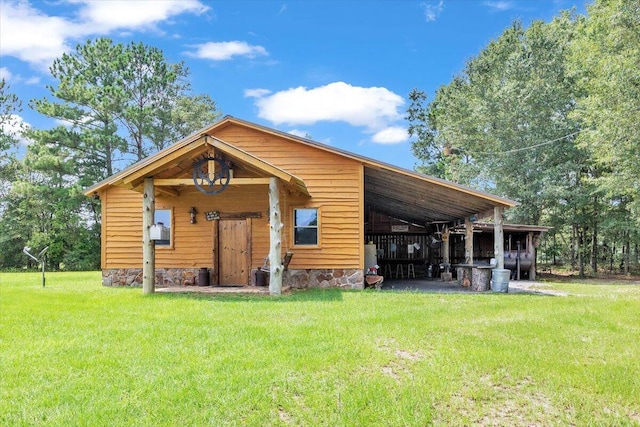 back of house with a lawn and central air condition unit