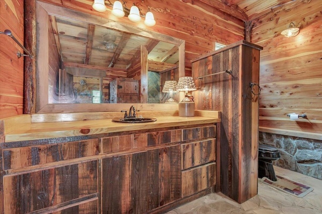 bathroom with lofted ceiling with beams, toilet, wooden ceiling, and wooden walls