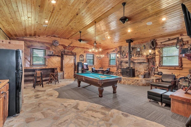 playroom featuring a wood stove, lofted ceiling, wooden walls, wood ceiling, and pool table