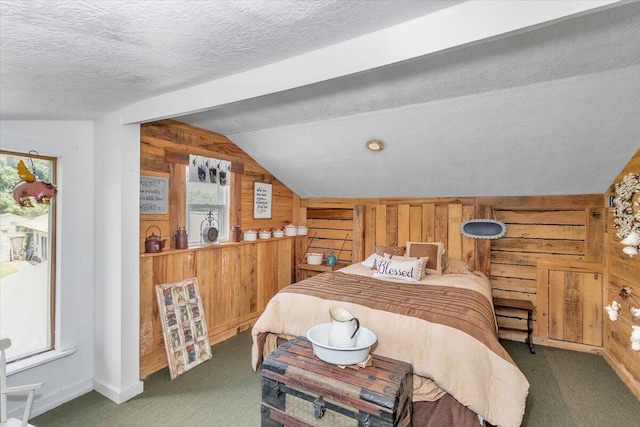 carpeted bedroom featuring lofted ceiling, multiple windows, wood walls, and a textured ceiling