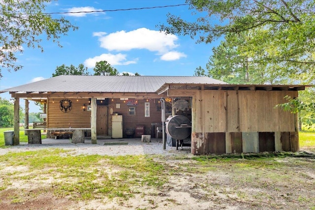 rear view of house with an outbuilding