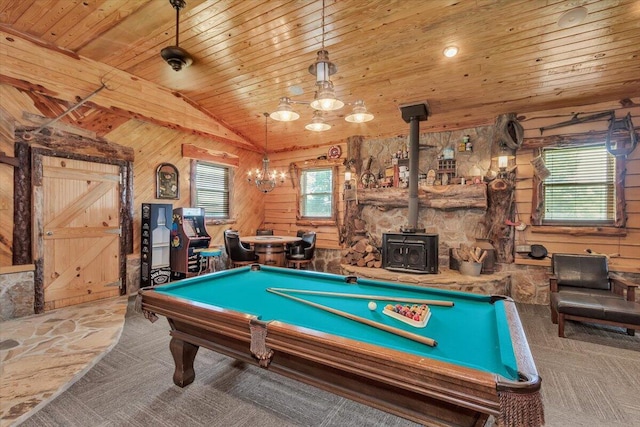 playroom with billiards, a wood stove, wooden ceiling, and wood walls