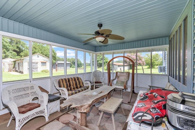 sunroom / solarium with ceiling fan