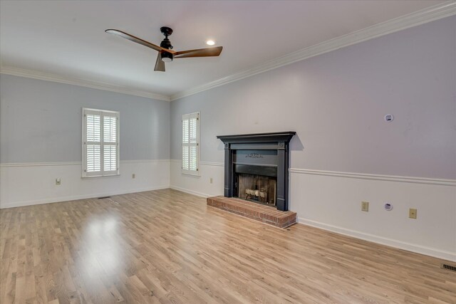 227 Water Oak Dr, Augusta, GA 30904 - living room featuring a brick fireplace, ornamental molding, wood finished floors, a ceiling fan, and wainscoting