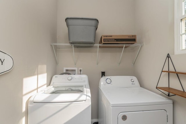 washroom with washer and dryer