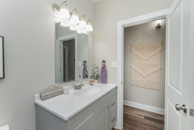 bathroom with vanity and hardwood / wood-style flooring