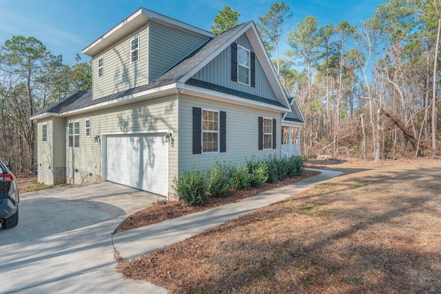 view of side of home with a garage