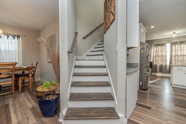 stairway with wood-type flooring