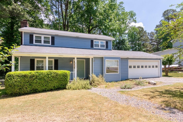 front facade with a front yard and a garage