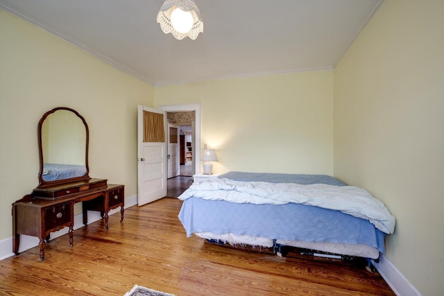 1203 Highland Ave, Augusta, GA 30904 - bedroom with ornamental molding and wood finished floors