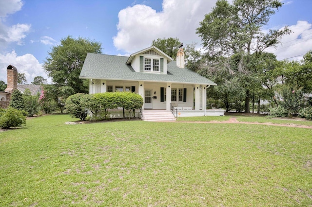 1203 Highland Ave, Augusta, GA 30904 - view of front of house with a chimney, a porch, and a front lawn