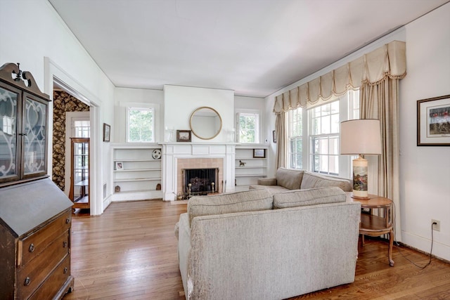 1203 Highland Ave, Augusta, GA 30904 - living room featuring wood finished floors, plenty of natural light, and a tile fireplace