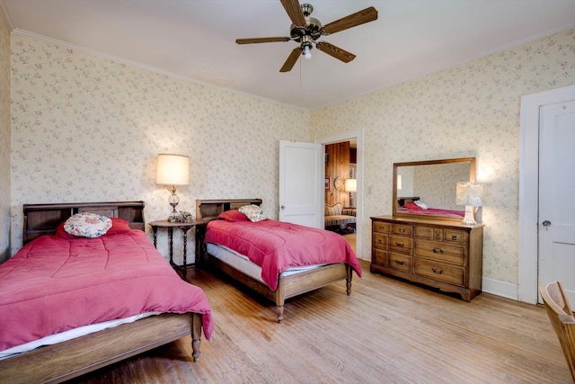 1203 Highland Ave, Augusta, GA 30904 - bedroom featuring ornamental molding, wood finished floors, wallpapered walls, and a ceiling fan
