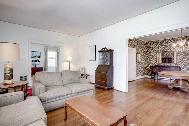 1203 Highland Ave, Augusta, GA 30904 - living area with light wood-type flooring and a chandelier