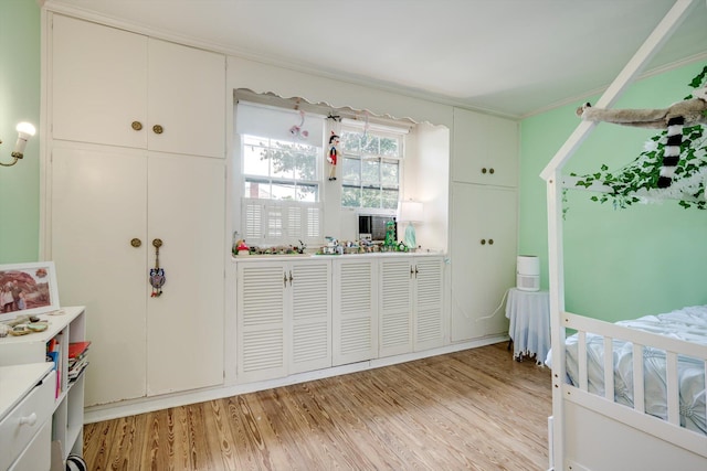 1203 Highland Ave, Augusta, GA 30904 - bedroom featuring light wood finished floors and ornamental molding