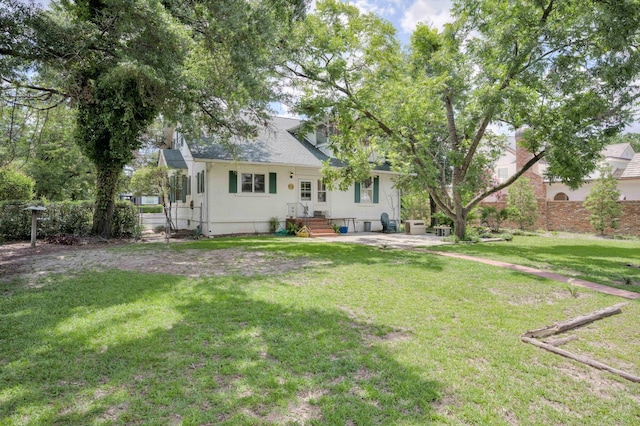 1203 Highland Ave, Augusta, GA 30904 - rear view of house featuring a yard and stucco siding