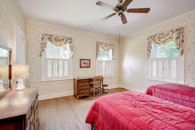 1203 Highland Ave, Augusta, GA 30904 - bedroom featuring multiple windows, wood finished floors, ornamental molding, and a ceiling fan