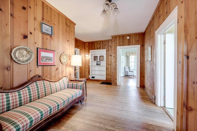 1203 Highland Ave, Augusta, GA 30904 - living area with wooden walls and light wood-style flooring