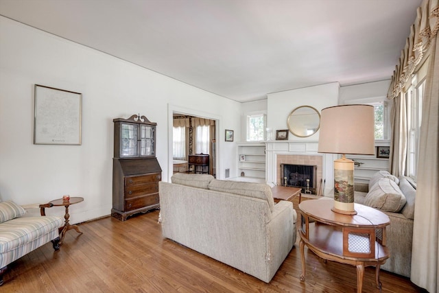1203 Highland Ave, Augusta, GA 30904 - living area with wood finished floors and a tiled fireplace