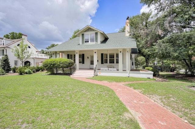 1203 Highland Ave, Augusta, GA 30904 - view of front of house with a porch, a chimney, a front lawn, and roof with shingles