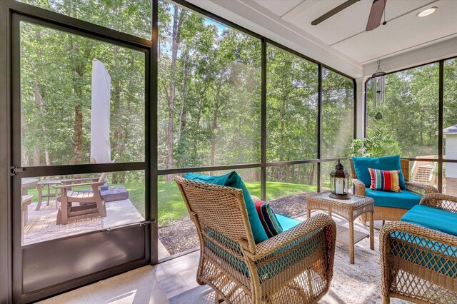 sunroom featuring a wealth of natural light and ceiling fan