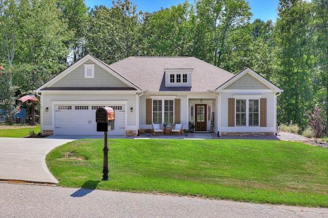 craftsman-style home featuring a garage and a front lawn