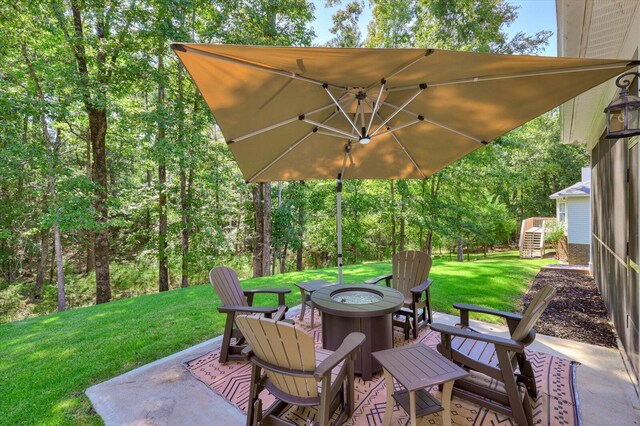 view of patio featuring an outdoor fire pit