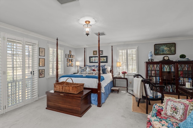 carpeted bedroom with visible vents, multiple windows, crown molding, and baseboards