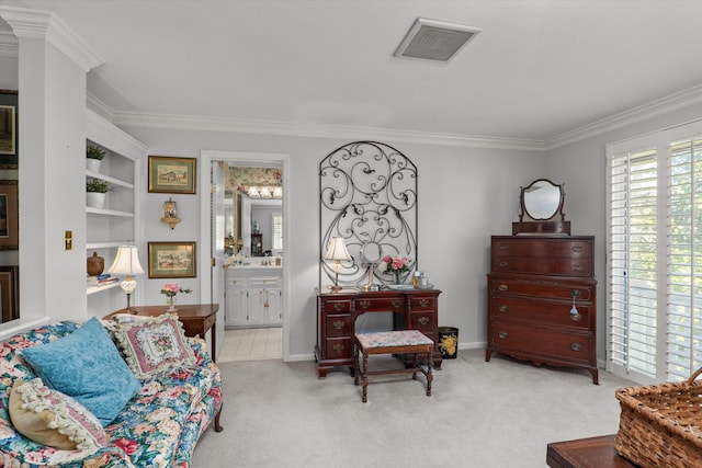 sitting room with visible vents, baseboards, carpet, and ornamental molding