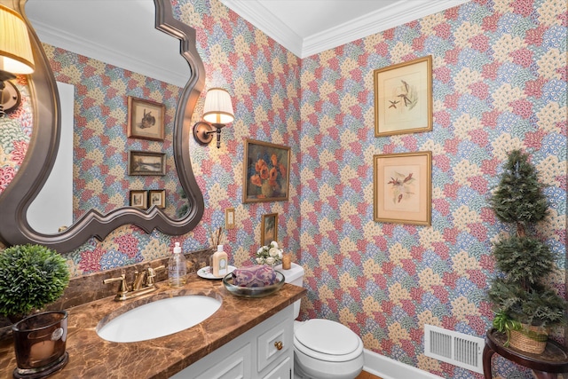 half bathroom featuring visible vents, toilet, ornamental molding, wallpapered walls, and vanity